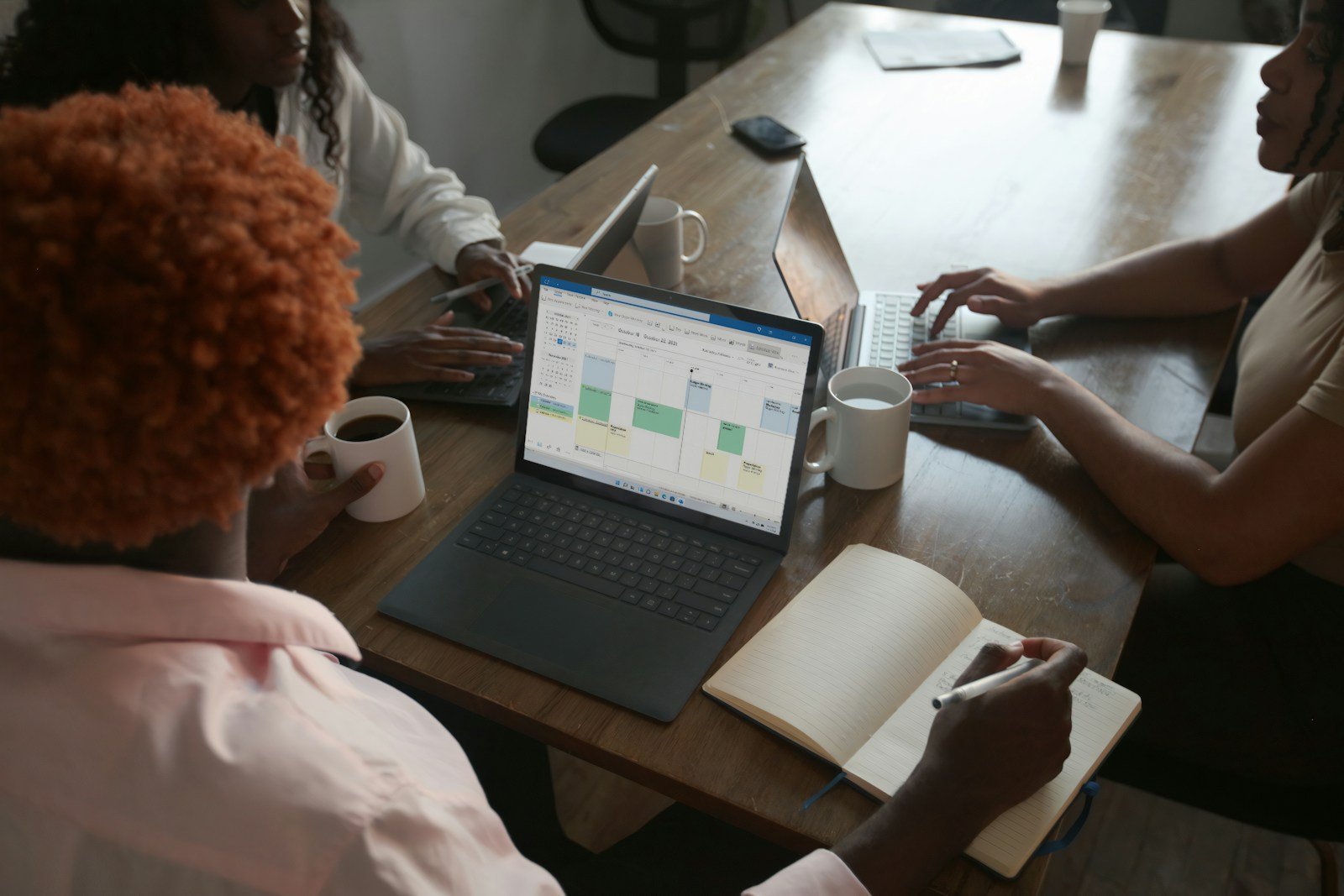 Working professionals comparing accelerated vs part-time online graduate programs